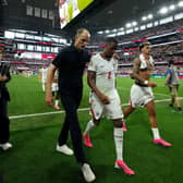 England head coach Thomas Tuchel (centre left) delivered a half-time message