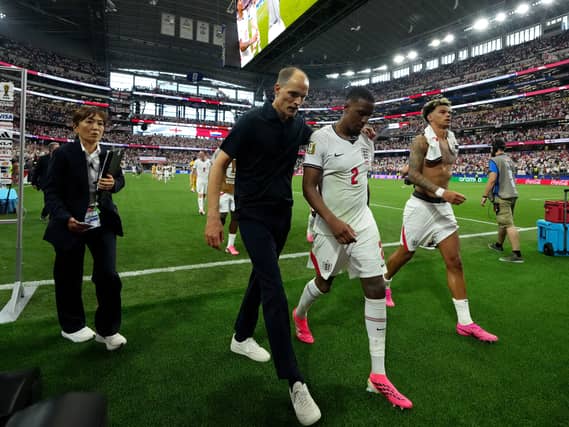 England head coach Thomas Tuchel (centre left) delivered a half-time message