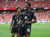Canada’s Jonathan David (right) celebrates after scoring his side's second goal (Emma Peterson/AP)