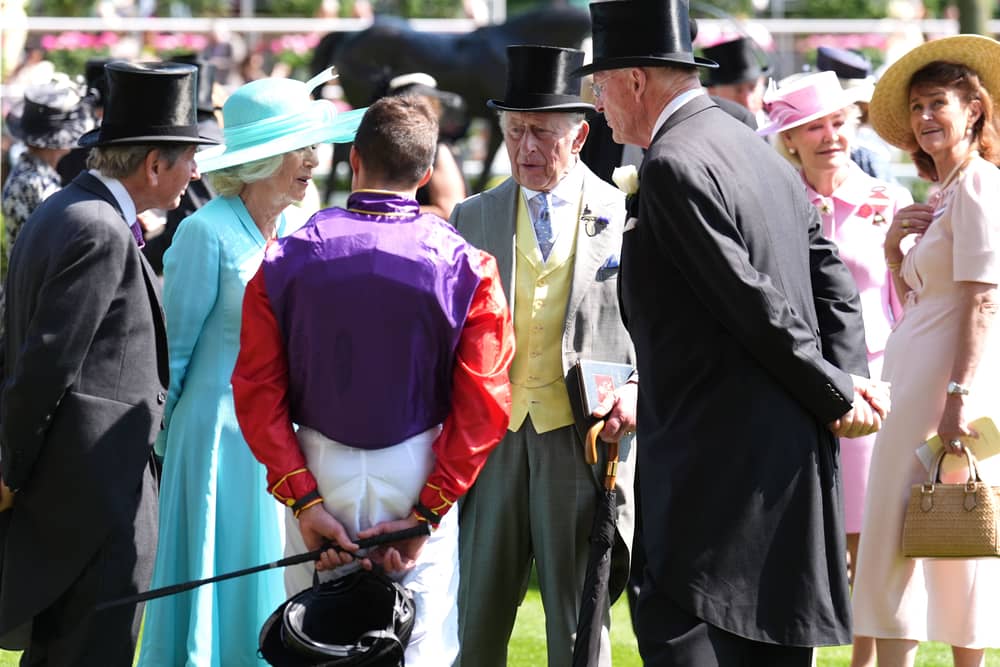 King Charles III (centre right) and Queen Camilla (second left) speak with jockey William Buick and trainer John Gosden before the Duke of Edinburgh Stakes