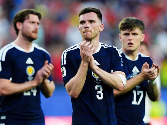 Scotland’s Andy Robertson applauds the fans after the defeat