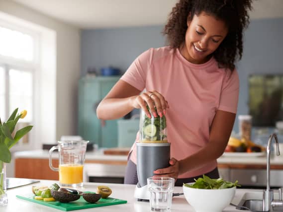 Woman making healthy juice
