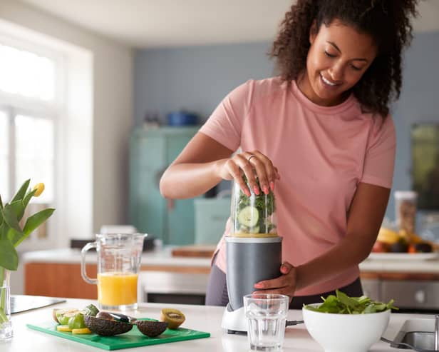 Woman making healthy juice
