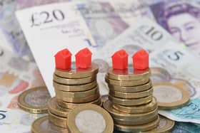 Models of homes on coins