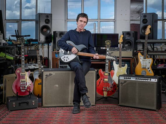 Johnny Marr with a selection of guitars