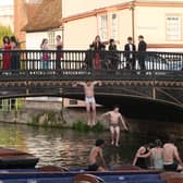 Students jumping off Magdelene Bridge and into the River Cam