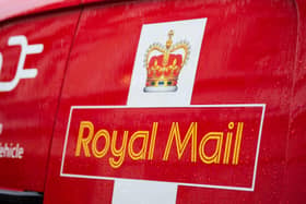 A Royal Mail logo on a van