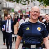 John Swinney in a Scotland strip