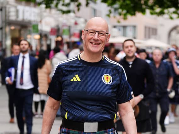 John Swinney in a Scotland strip