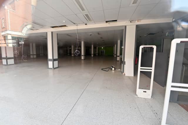 Some of the empty buildings in Walsall town centre.   Park Place and surrounding shops where a mannequin with an axe is the only figure of sorts to be seen .
