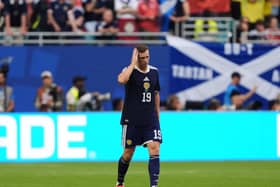 Lewis Ferguson reacts during defeat by Brazil