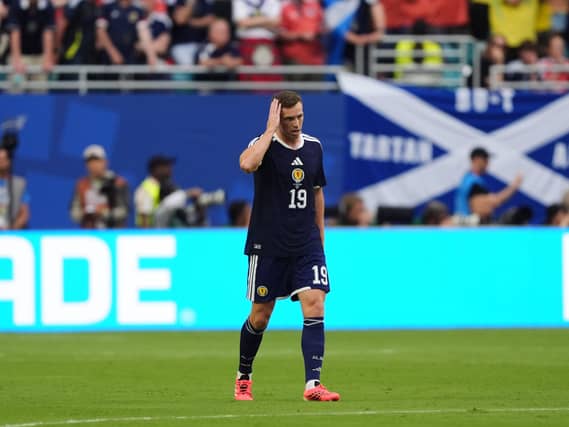 Lewis Ferguson reacts during defeat by Brazil