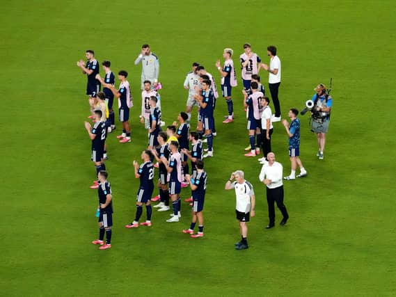 Steve Clarke and players on the pitch after Scotland's match against Brazil
