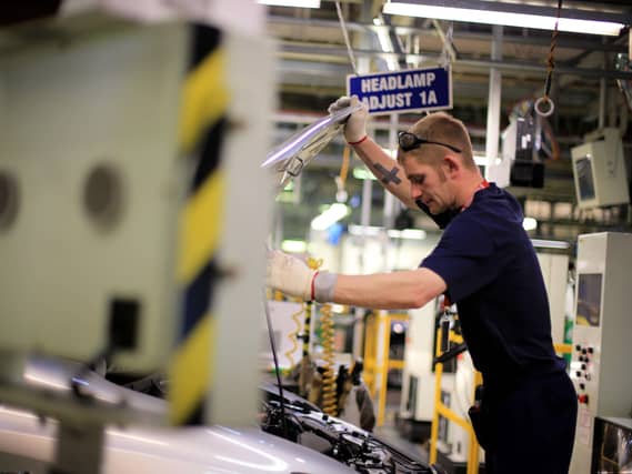 Worker on a Toyota Corolla production line at Toyota?s Derbyshire factory at Burnaston, Derby UK UK.