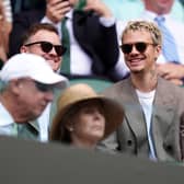 Romeo Beckham wearing sunglasses in the stands at Wimbledon