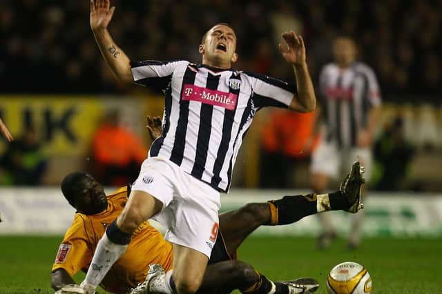Wolves' George Elokobi tackles West Brom's Roman Bedner in 2008