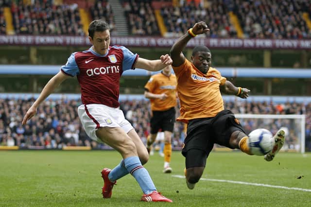 Wolves' George Elokobi tackles Aston Villa's Stewart Downing in 2010