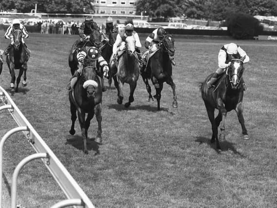 Mtoto (right) ridden by Michael Roberts comes in to win the Coral-Eclipse Stakes at Sandown Park