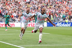 Rangers' Nico Raskin helps Belgium teammate Youri Tielemans celebrate his late winning goal against Senegal at the World Cup on Wednesday night. Cr: Getty Images.