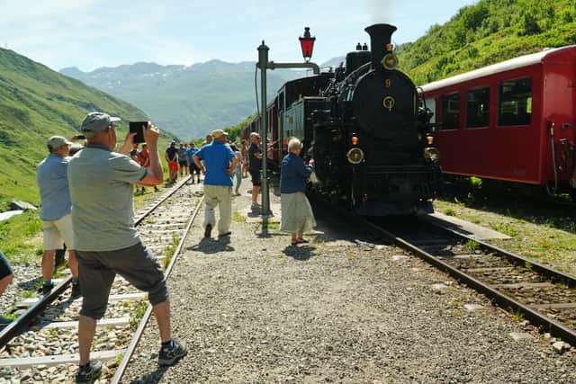 Tourists mark milestone anniversary of Alpine rail route seen in James ...