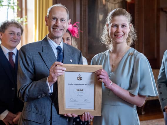 Prince Edward giving his daughter her DofE award