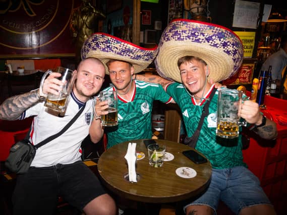 Fans wearing England and Mexico shirts at a bar in Condesa, Mexico City (James Manning/PA)