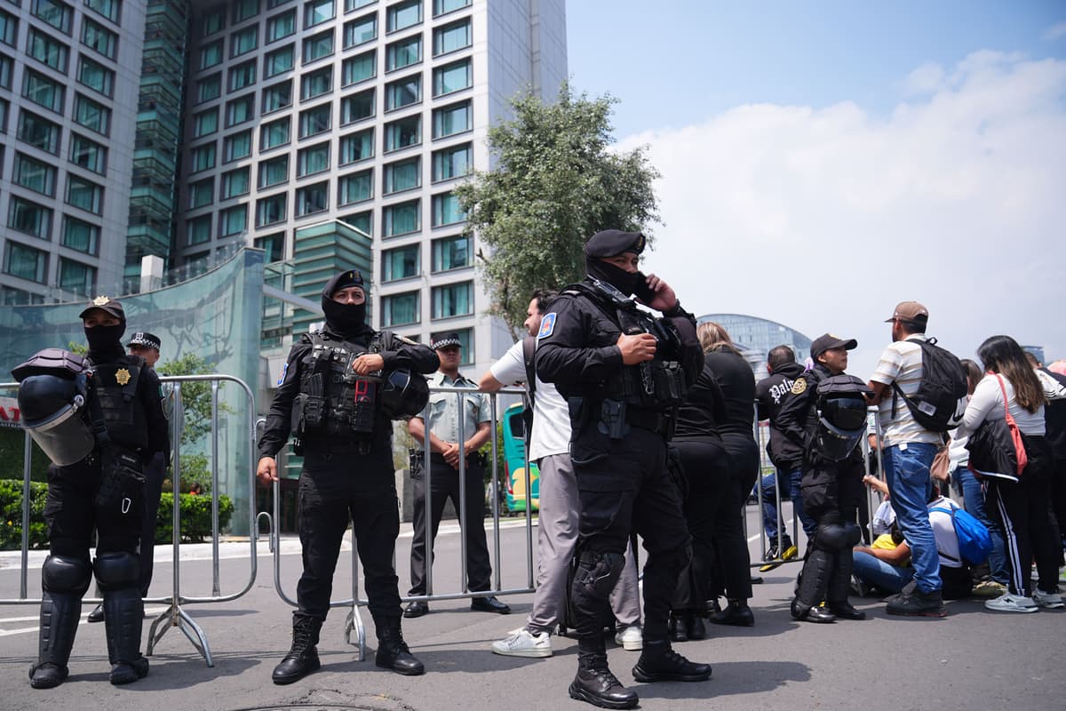 100 riot police guard England hotel as team receive hostile reception in ...