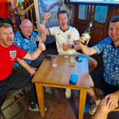 The late hour didn’t dampen the spirits of these England fans in the Crown