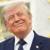 US President Donald Trump smiles after ringing the opening bell at the New York Stock Exchange