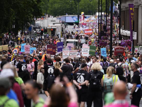 People with placards during the Pride in London parade in central London