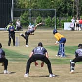 Cricket at Worfield , where Shropshire (in yellow) take on Worcestershire. Worc: Harry Darley, bowls at Connor Marshall.