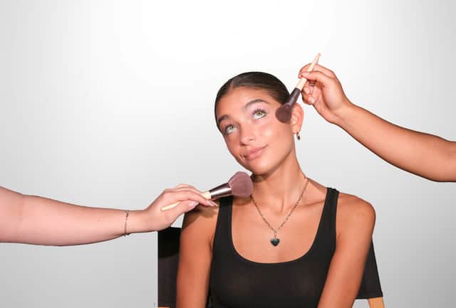 Woman having makeup done
