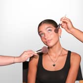Woman having makeup done