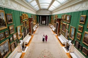 Royal Collection Trust staff with paintings on display in the Picture Gallery at Buckingham Palace, London, which has undergone a once-in-a-generation re-display