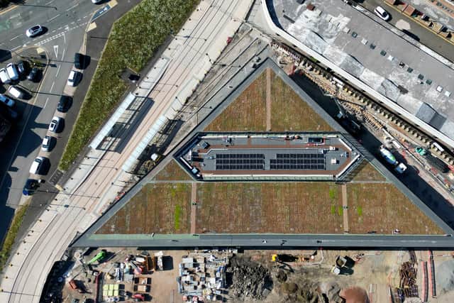 The roof of the new bus station features solar panels and hardy, drought resistant plants to support the environment