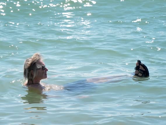 A man floats in water