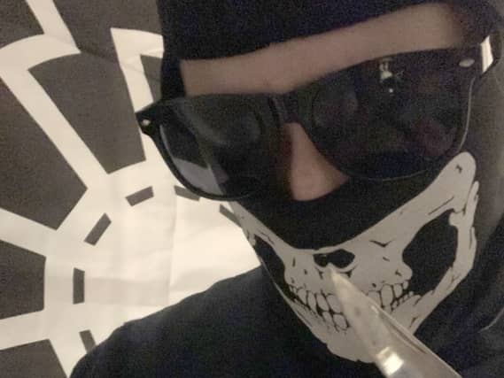 Alfie Coleman in a skull mask holding a knife
