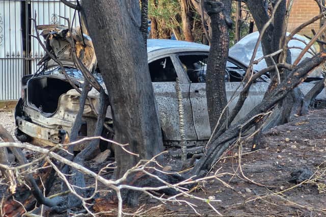The car could be seen burnt out alongside burnt trees