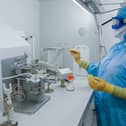 Staff work inside the AstraZeneca laboratory in Macclesfield