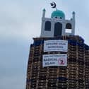 A bonfire pyre with a replica mosque on the top