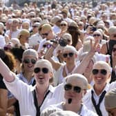 People wearing bald caps and shades in the crowd at the BST festival