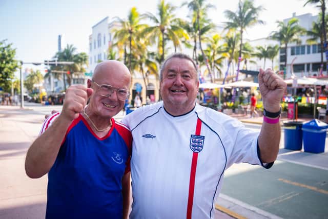 England fans Norman Bartlam, 68, (left) and Paul Dubberley, 67, pose on South Beach in Miami.