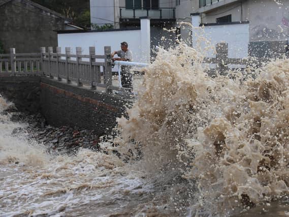 Huge waves crash on the coastline ahead of Typhoon Bavi in Wenling in eastern China’s Zhejiang province