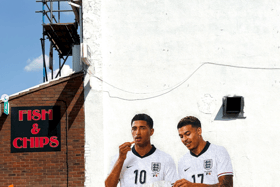 Mural of Jude Bellingham and Morgan Rogers eating orange chips appears in Quinton