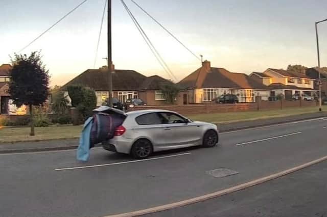 The pair were spotted loading the bouncy castle into a silver BMW