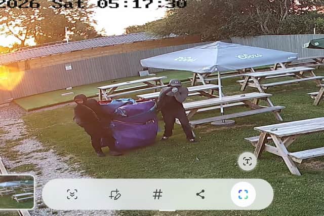 After entering the garden, the pair were spotted taking the bouncy castle