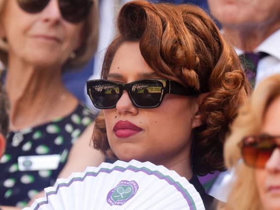 Raye fanning herself in the Royal Box at Wimbledon