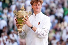 Jannik Sinner holds the Wimbledon trophy