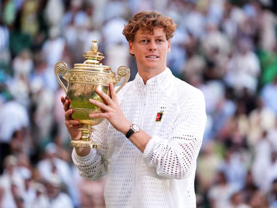 Jannik Sinner holds the Wimbledon trophy