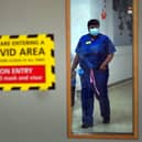 A nurse wearing PPE in a hospital during the Covid pandemic